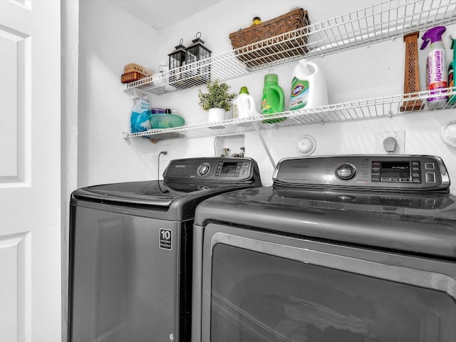 laundry area featuring washer and dryer and laundry area