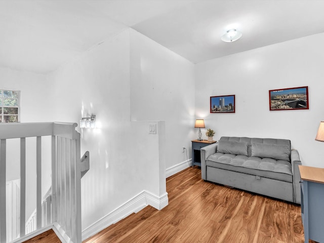 living room with baseboards and wood finished floors