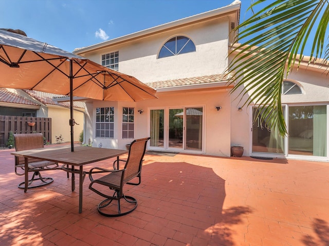 exterior space featuring fence and outdoor dining space