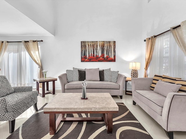 living area featuring a healthy amount of sunlight and light tile patterned floors