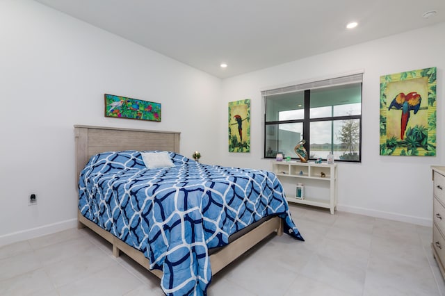 bedroom with recessed lighting and baseboards