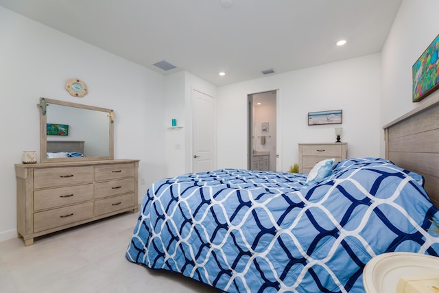 bedroom featuring light tile patterned flooring, ensuite bath, visible vents, and recessed lighting