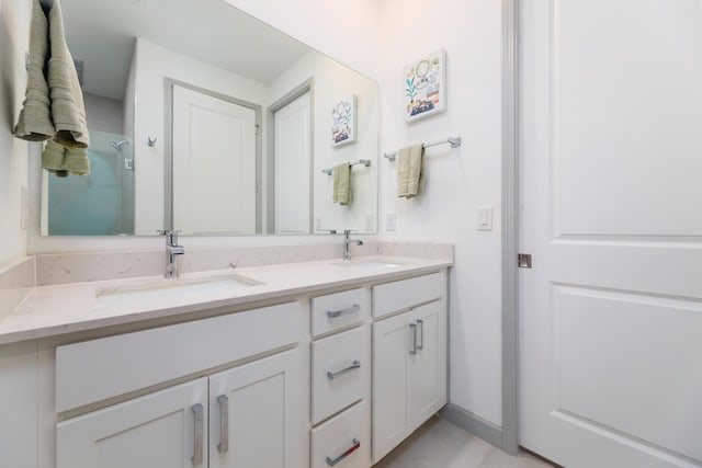 bathroom featuring double vanity and a sink