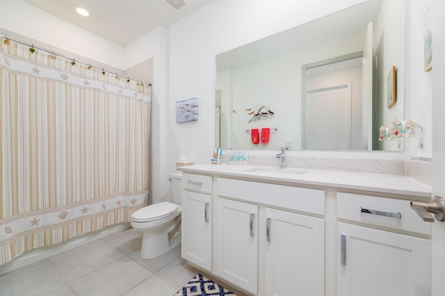 full bathroom featuring a shower with curtain, vanity, toilet, and tile patterned floors