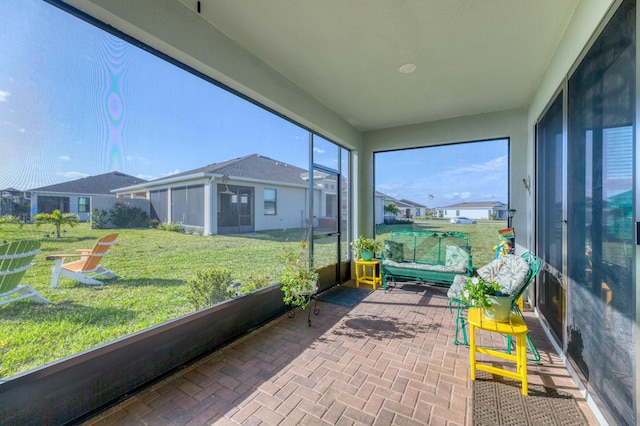 sunroom / solarium with a residential view