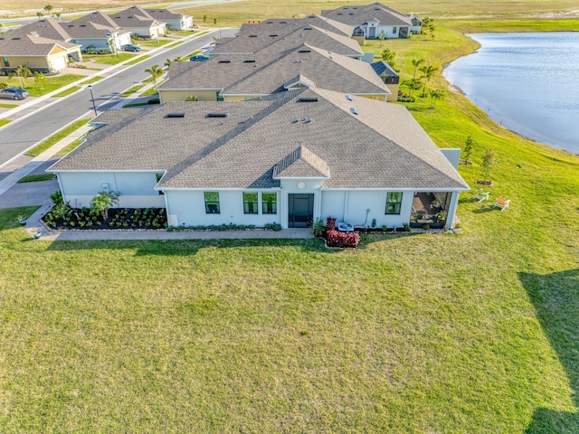 bird's eye view featuring a residential view and a water view