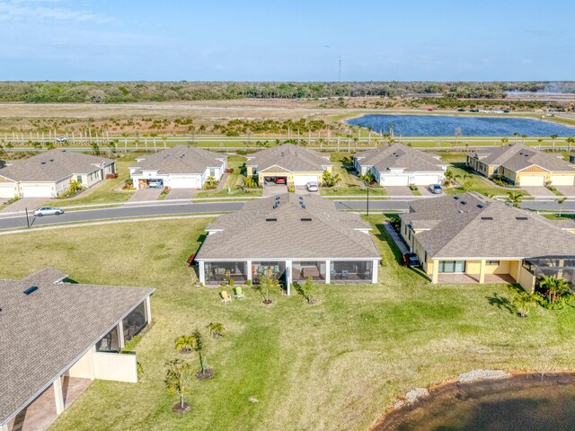 bird's eye view with a water view and a residential view