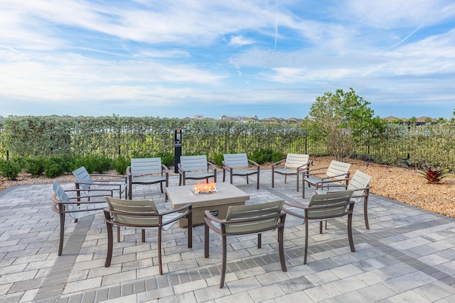 view of patio / terrace with an outdoor fire pit