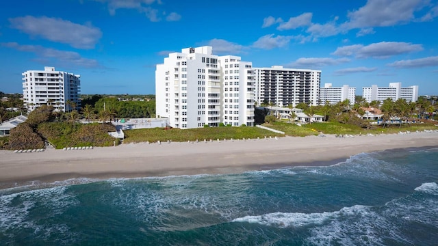 aerial view with a view of city, a water view, and a beach view