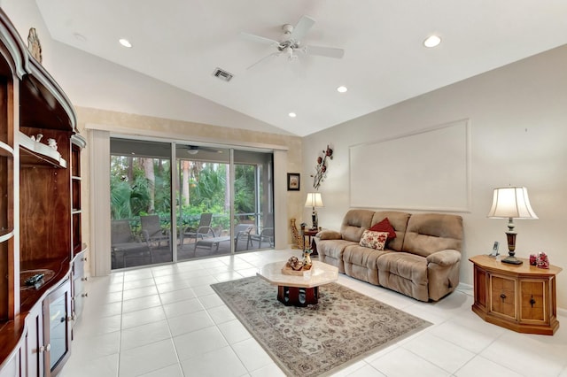 living area featuring lofted ceiling, visible vents, ceiling fan, and light tile patterned floors