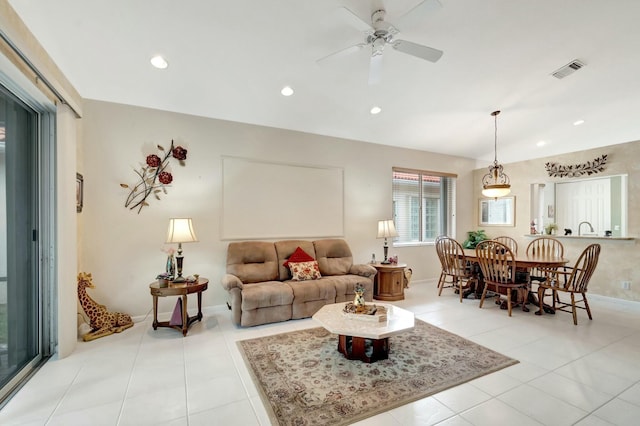 living area featuring recessed lighting, visible vents, baseboards, and light tile patterned flooring