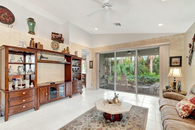 living area with light tile patterned floors, visible vents, ceiling fan, vaulted ceiling, and recessed lighting