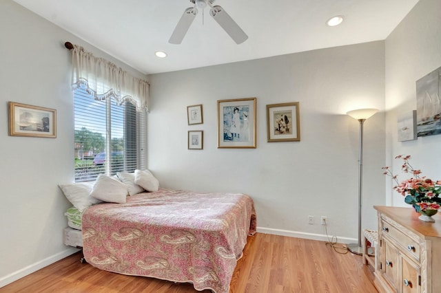 bedroom with light wood-style flooring, baseboards, and recessed lighting