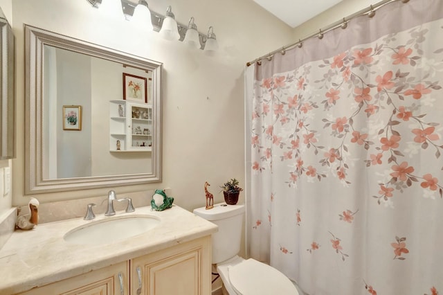 full bathroom with a shower with shower curtain, vanity, and toilet