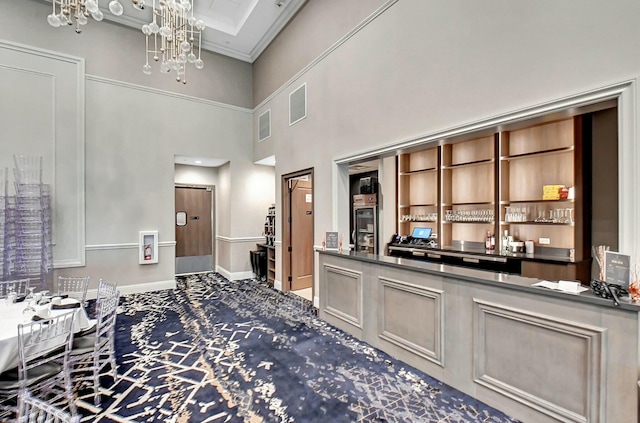 bar with carpet floors, visible vents, a chandelier, and baseboards