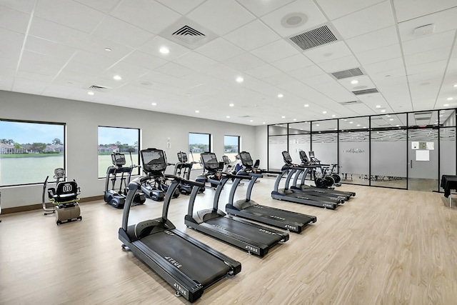 gym featuring wood finished floors and visible vents