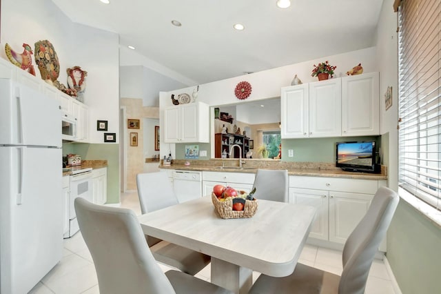 dining room featuring recessed lighting, light tile patterned flooring, and vaulted ceiling