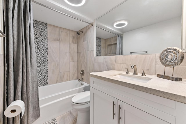 bathroom featuring vanity, shower / tub combo, tile walls, toilet, and tasteful backsplash