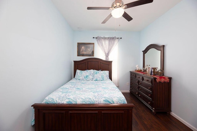 bedroom with ceiling fan, baseboards, and dark wood-style flooring