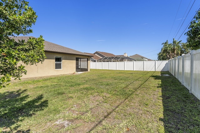 view of yard featuring a fenced backyard