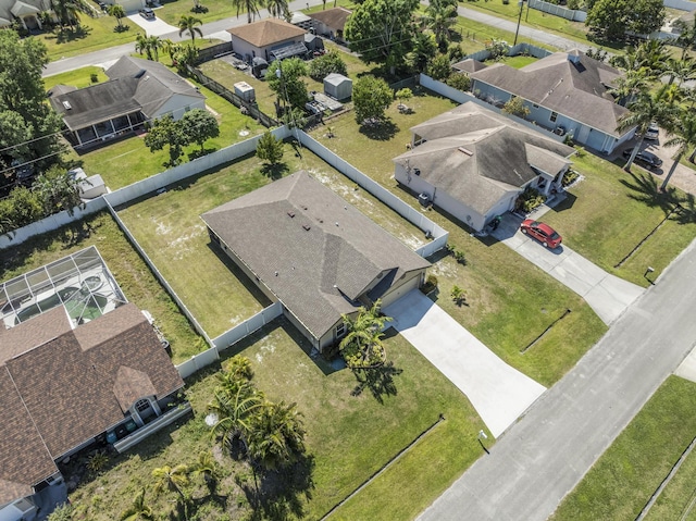 birds eye view of property with a residential view