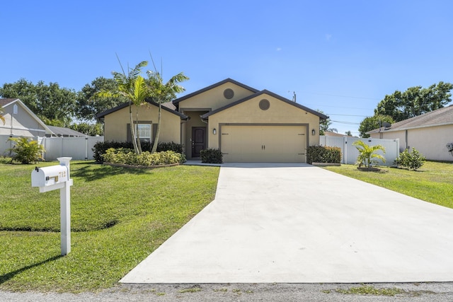 ranch-style home featuring stucco siding, a front lawn, fence, concrete driveway, and an attached garage