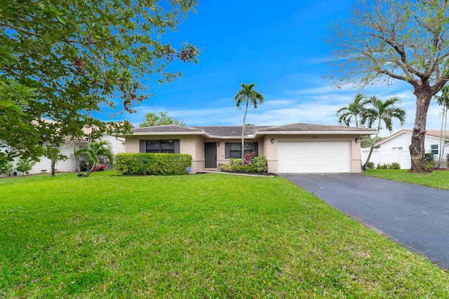 ranch-style home featuring aphalt driveway, stucco siding, an attached garage, a tiled roof, and a front lawn