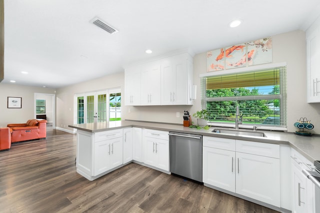 kitchen featuring french doors, visible vents, stainless steel dishwasher, a sink, and a peninsula