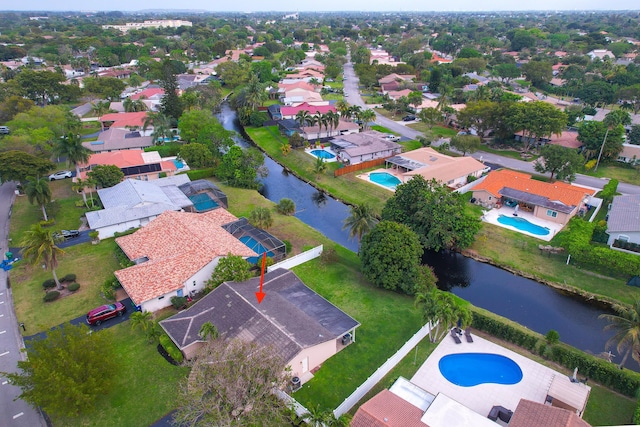 aerial view with a water view and a residential view