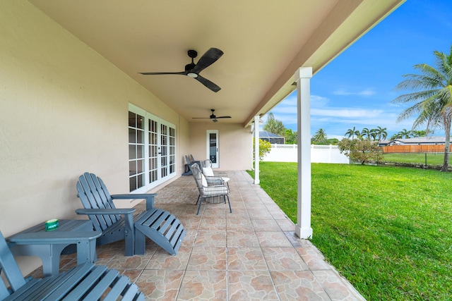 view of patio / terrace with a fenced backyard, ceiling fan, and french doors