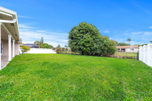 view of yard with a fenced backyard