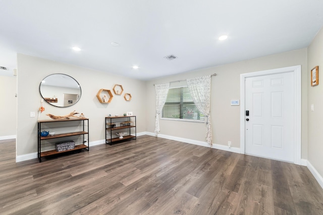 foyer with recessed lighting, wood finished floors, visible vents, and baseboards