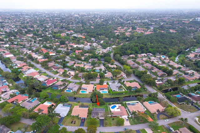 birds eye view of property with a residential view