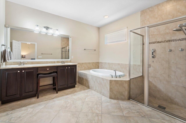 bathroom with a garden tub, double vanity, a sink, and a shower stall