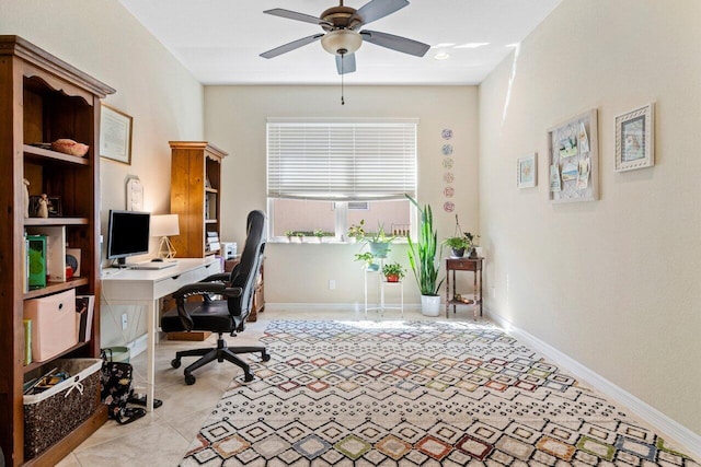 office with ceiling fan, baseboards, and light tile patterned floors