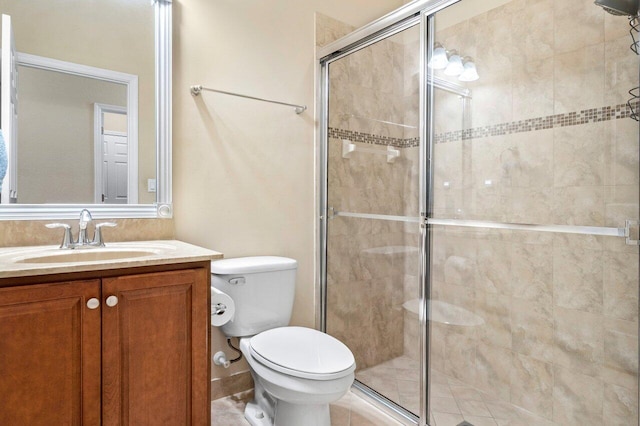 full bath with toilet, a stall shower, and vanity