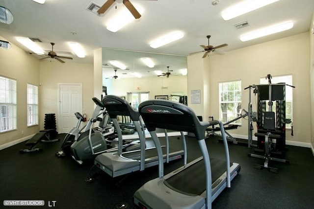 exercise room with visible vents and baseboards