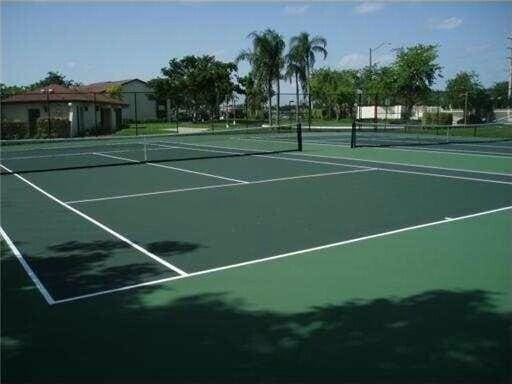 view of sport court with fence