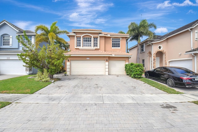 view of front of house with a garage, a tiled roof, decorative driveway, and stucco siding