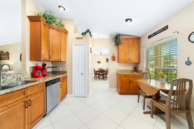 kitchen with a sink, brown cabinets, and stainless steel dishwasher