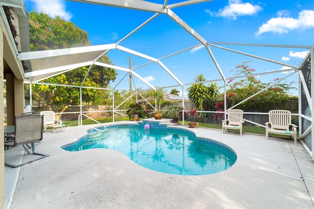 view of pool with a lanai, a patio area, a fenced in pool, and a fenced backyard