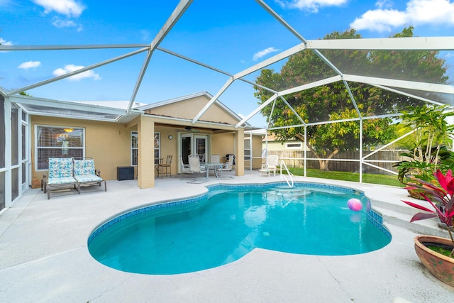 view of swimming pool with a fenced in pool, fence private yard, french doors, a ceiling fan, and a patio