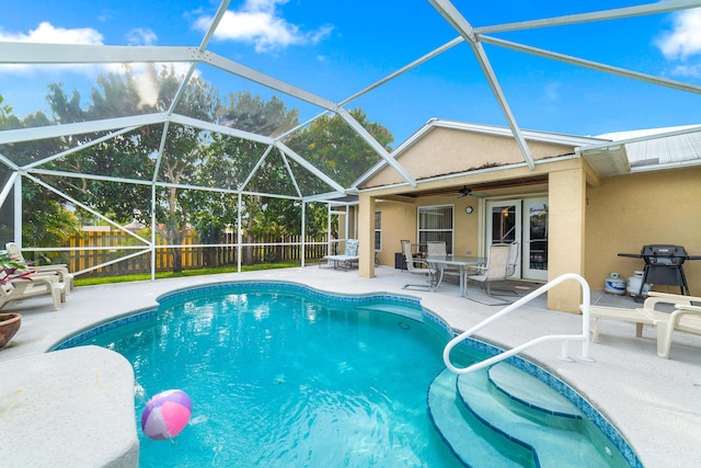 view of swimming pool with a patio, a fenced backyard, a fenced in pool, and ceiling fan