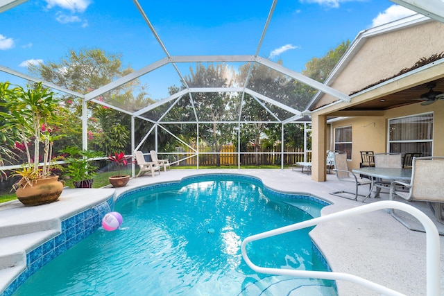 view of swimming pool with a patio area, ceiling fan, a fenced backyard, and a fenced in pool