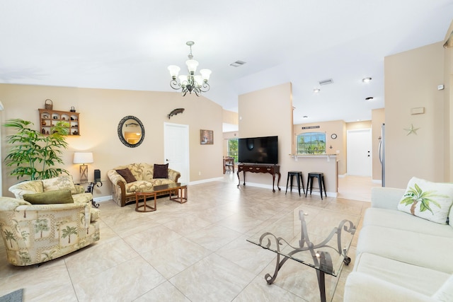 living room featuring vaulted ceiling, a notable chandelier, and baseboards