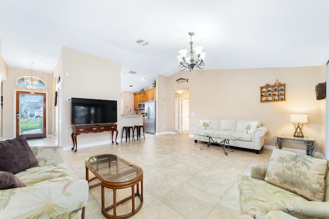 living room featuring visible vents, baseboards, an inviting chandelier, and vaulted ceiling