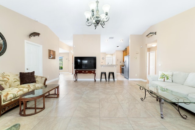 living room featuring baseboards, lofted ceiling, a notable chandelier, and light tile patterned flooring