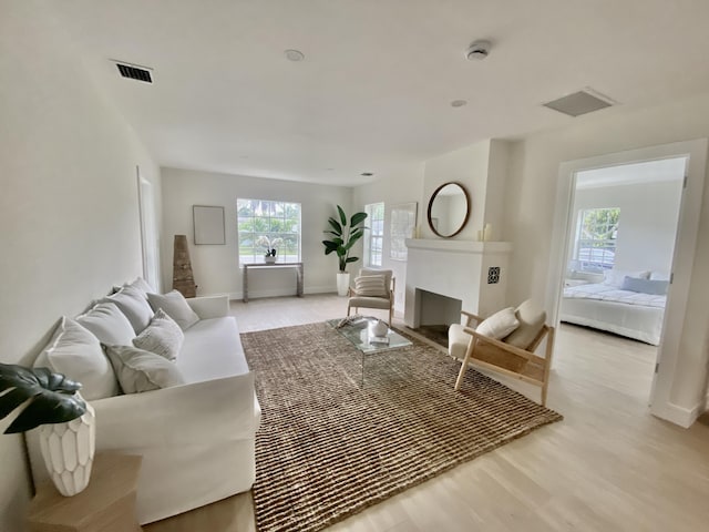 108 NW 4th Ave, Delray Beach, FL 33444 - living room with baseboards and light wood-type flooring