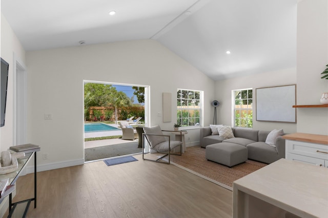 108 NW 4th Ave, Delray Beach, FL 33444 - living room with light wood-style flooring, baseboards, high vaulted ceiling, and recessed lighting