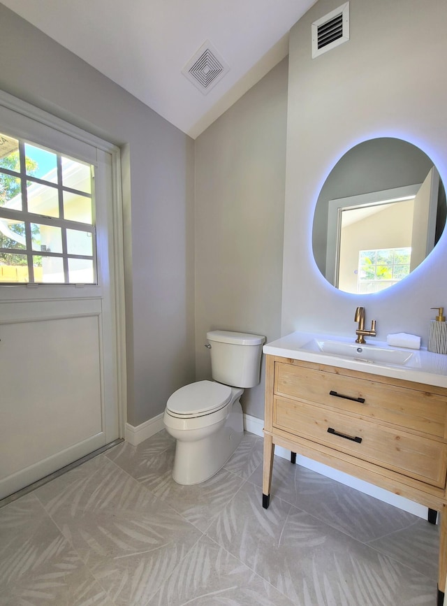 108 NW 4th Ave, Delray Beach, FL 33444 - half bath featuring baseboards, lofted ceiling, vanity, and toilet